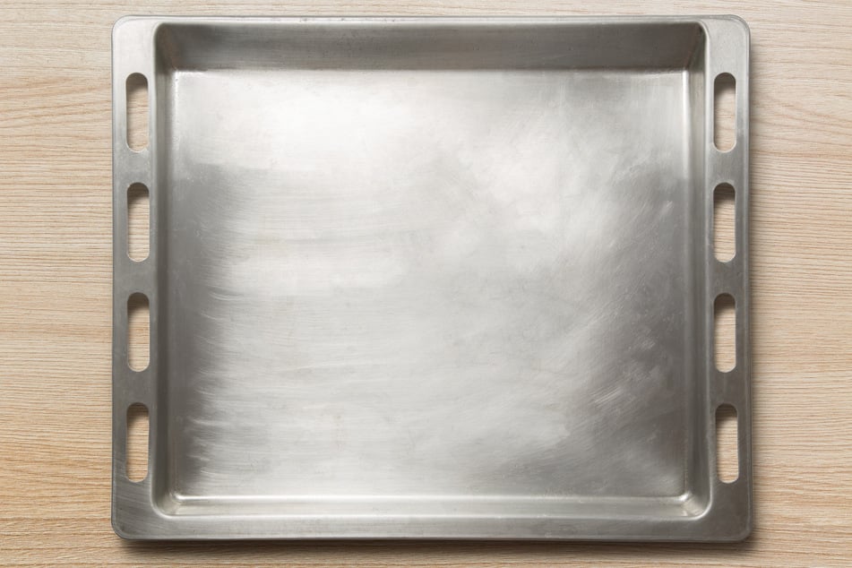 Apple and lemon peels can actually help to clean aluminum baking sheets.