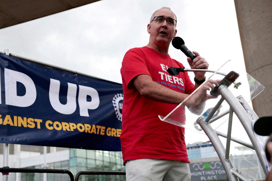 UAW President Shawn Fain announced the deal with Stellantis, which will see a cumulative raise in the top wage of 33%.