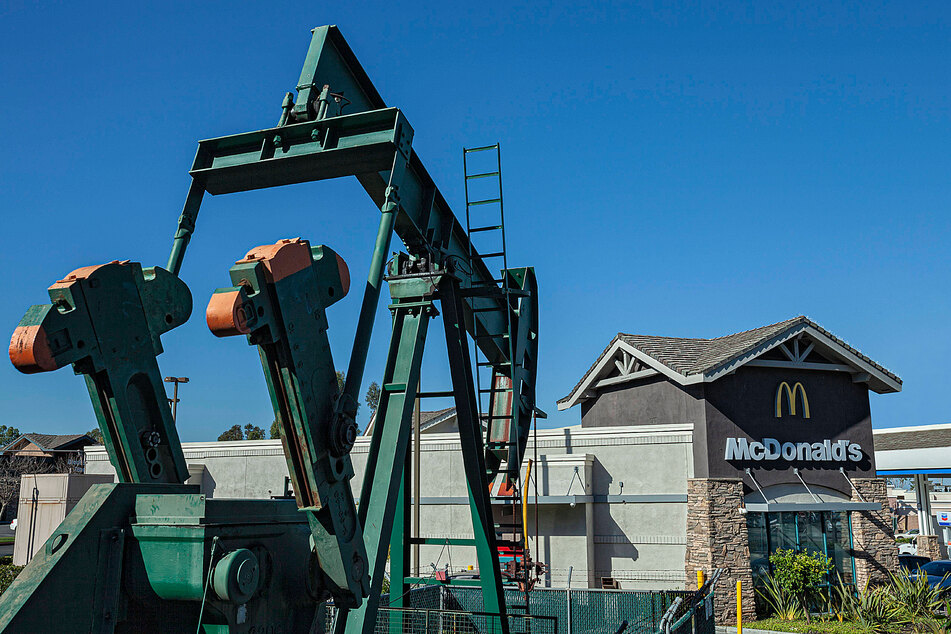A McDonald's in Los Angeles next to a disused pump jack...Both are climate offenders.