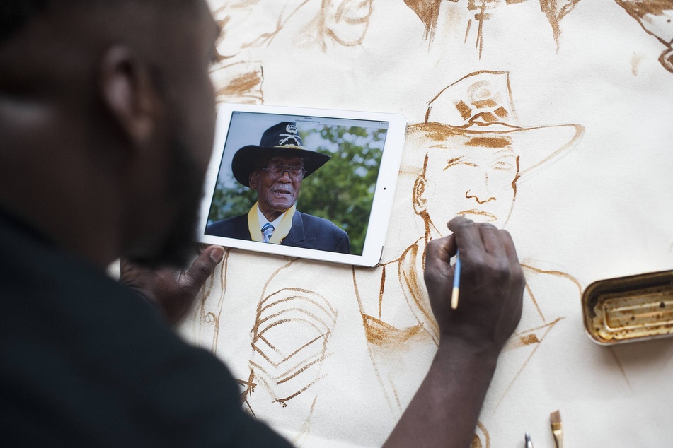 Artist John Barger paints a portrait of the last original Buffalo Soldier, Mark Matthews, who served in World War II.
