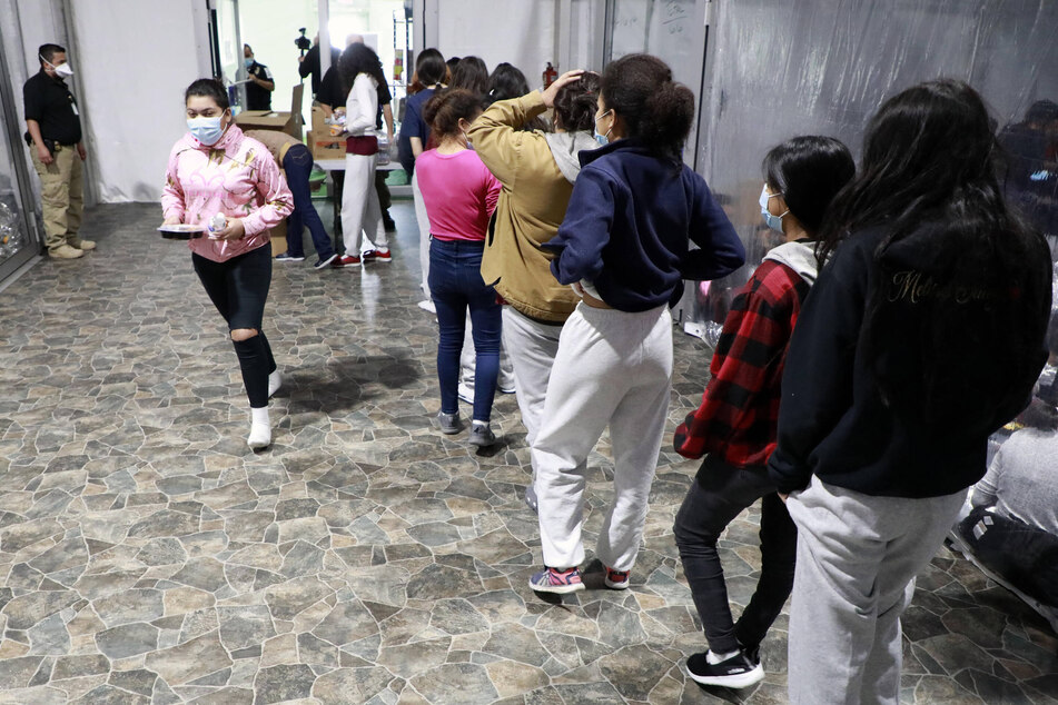 Unaccompanied migrant children and families are pictured at the US Customs and Border Patrol immigration processing center in Donna, Texas, in March 2021.
