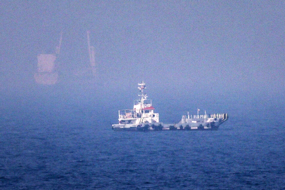 Ships sail near the Strait of Hormuz off the east coast of the United Arab Emirates.
