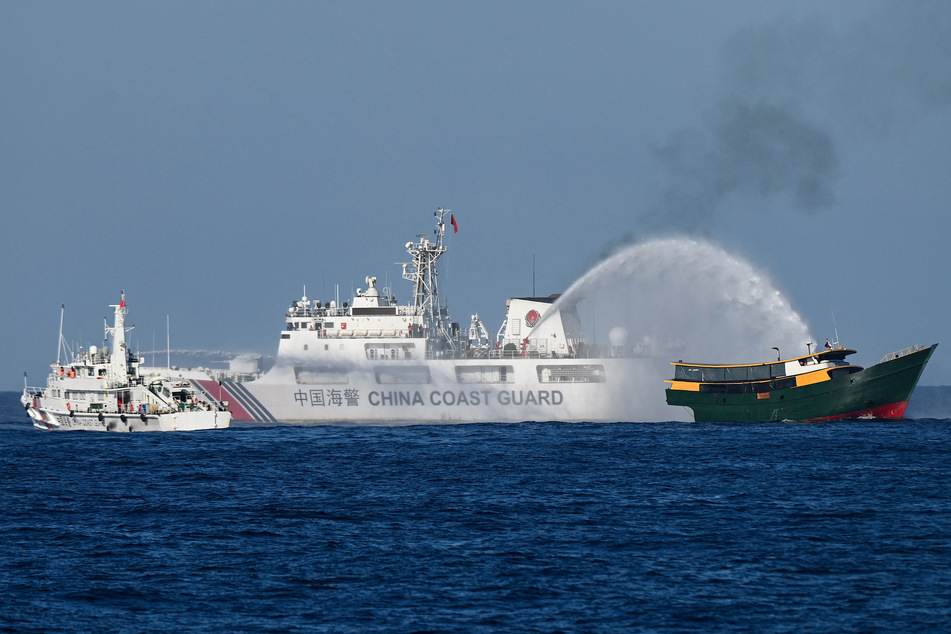 Tensions between China and the Philippines rose after a Chinese Coast Guard ship fired water cannons at Filipino vessels on Tuesday.