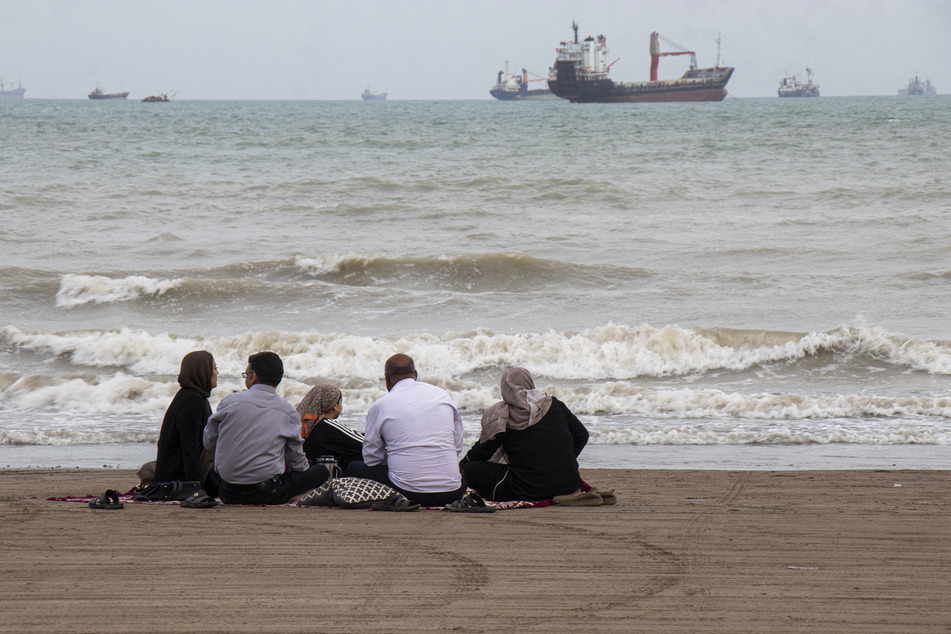 Iranians are seen at Suru Beach in Bandar Abbas along the Strait of Hormuz on April 24, 2026.