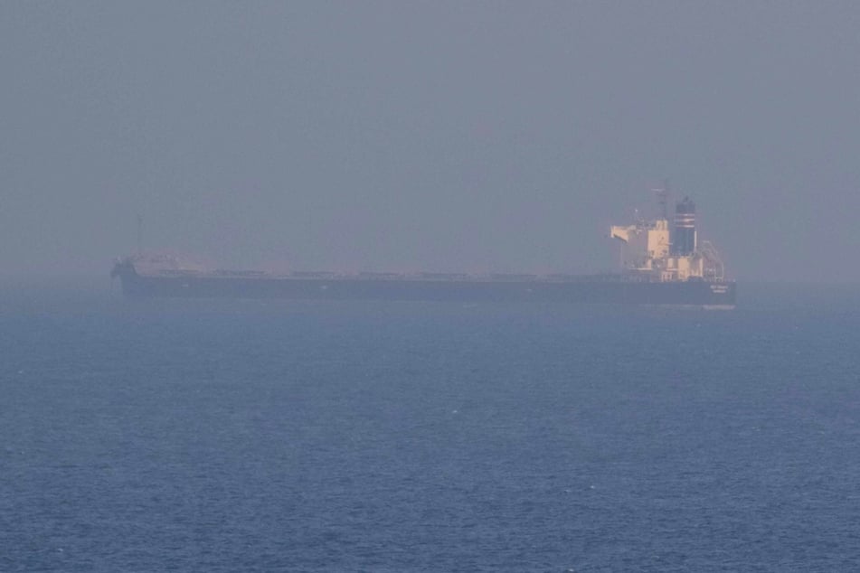 A ship carrying Ukrainian grain is seen in the Black Sea near the port of Odesa amid Russia's invasion.