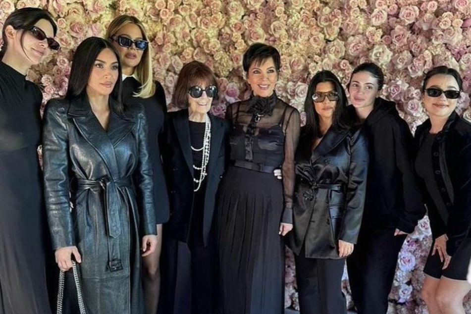 Kylie Jenner (l) has revived those pesky pregnancy rumors after rocking a suspicious fit at her late aunt Karen's funeral.