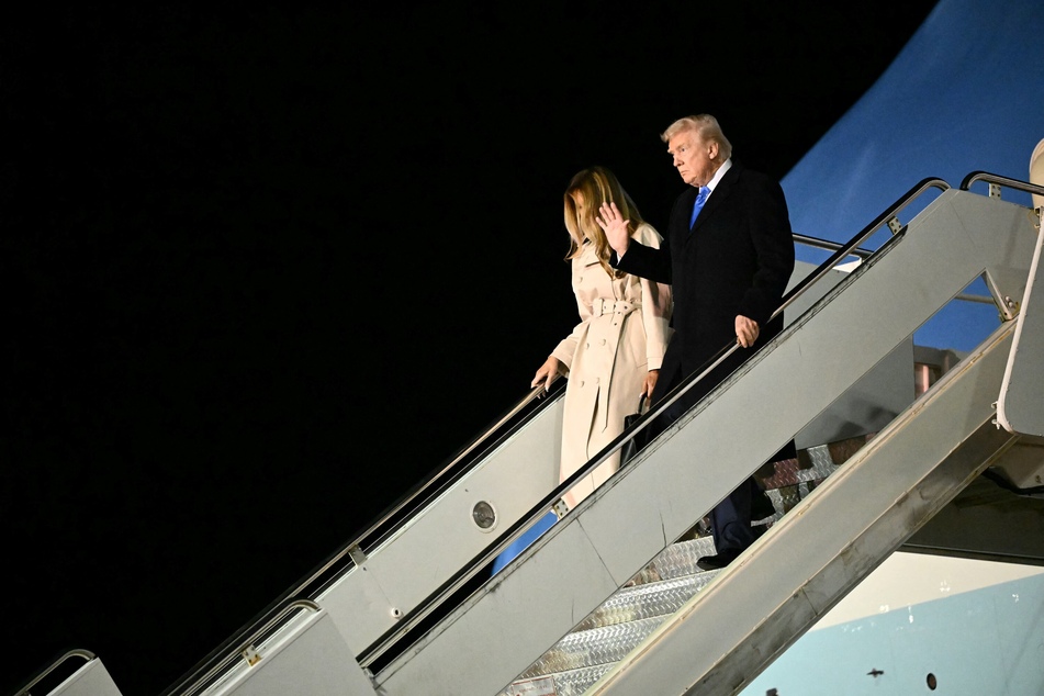 President Donald Trump and First Lady Melania Trump step off Air Force One upon arrival at Leonardo da Vinci International Airport in Rome on April 25, 2025.