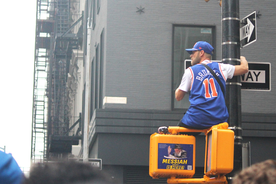 Fans hit the streets early to get a glimpse of the parade route in New York City on Thursday morning.