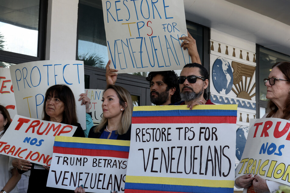 Miami-Dade County Democratic Party Chair Laura Kelley (second l.) joins with others to support a resolution in favor of reinstating TPS for Venezuelans on February 13, 2025.