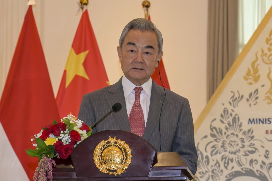 Chinese Foreign Minister Wang Yi said the US and China need to work through and overcome a range of issues ahead of the September summit.