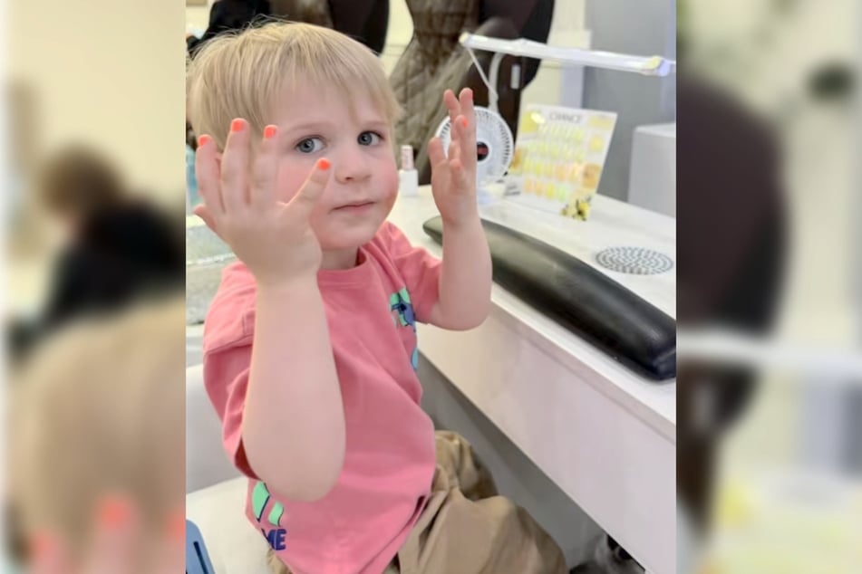 Iver chose to get his nails painted in his favorite color – orange!
