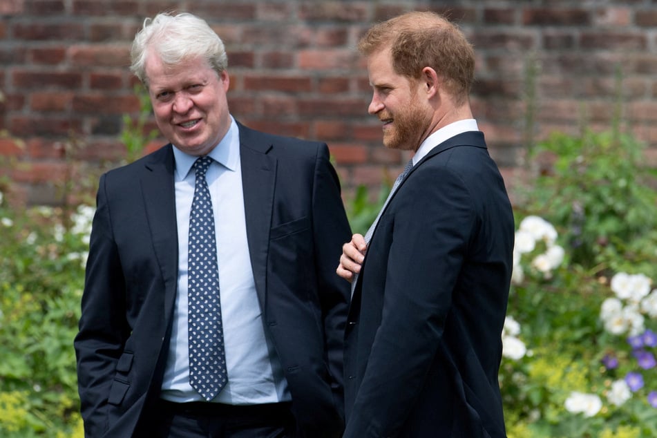 Prince Harry (r.) talks with his uncle, Charles Spencer (l.), during the unveiling of a statue commissioned of his mother, Princess Diana, in the Sunken Garden at Kensington Palace on July 1, 2021.