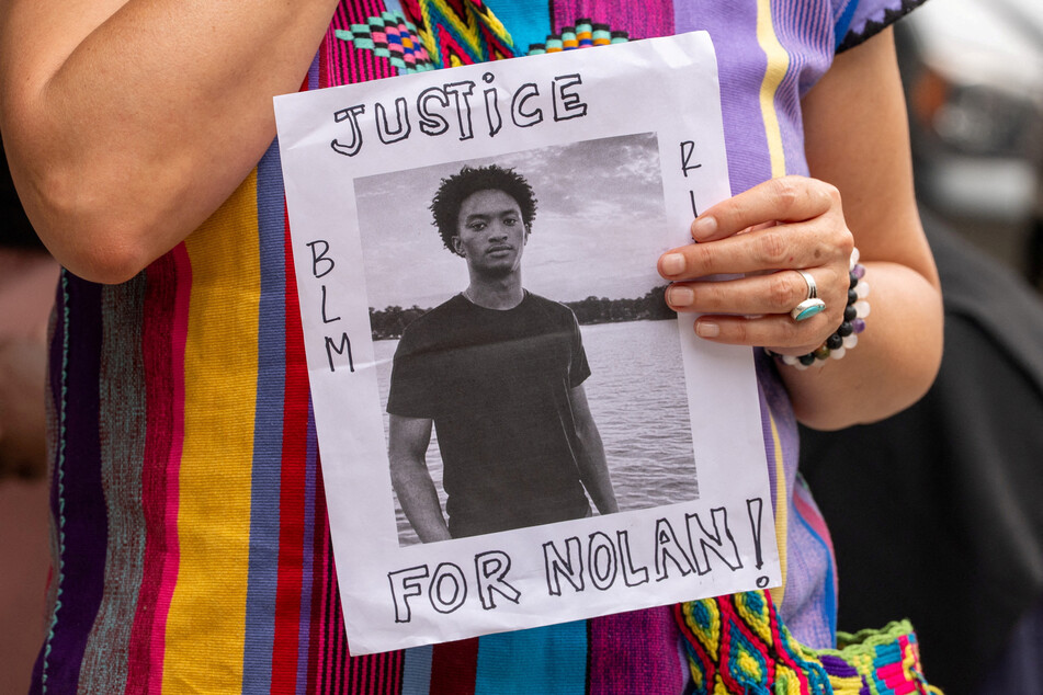 A person holds a sign that reads, "Justice for Nolan" outside of the National Action Network headquarters in Manhattan, New York City, on July 10, 2026.