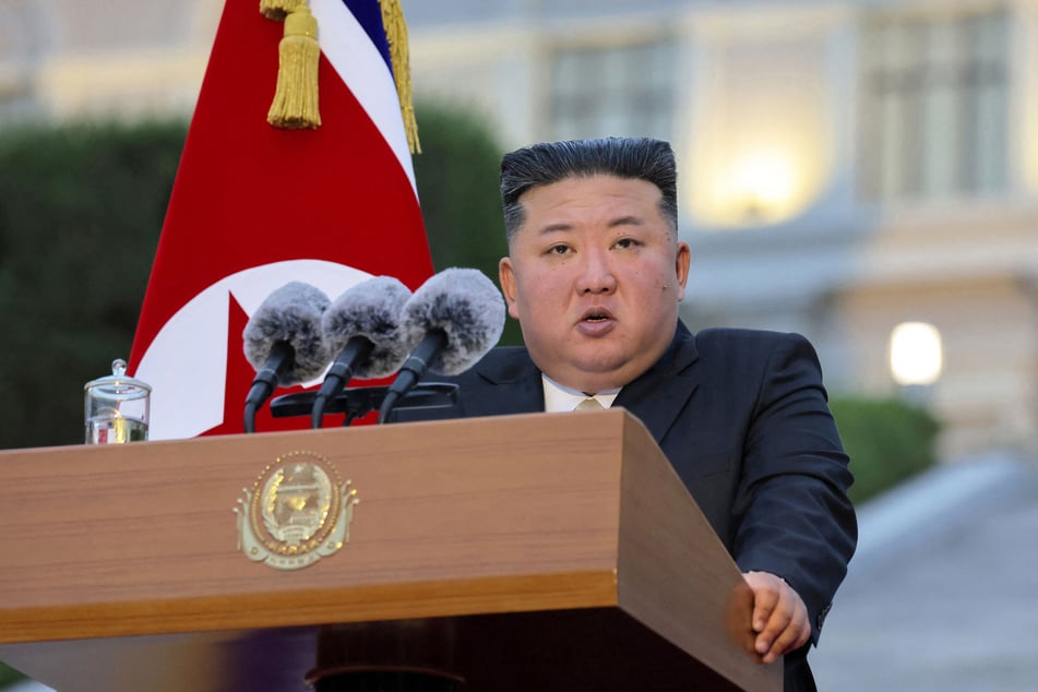 North Korean leader Kim Jong Un delivers a speech during a congratulatory visit to mark the institution's 80th founding anniversary at Kim Il Sung University on Thursday. Kim was seen watching the missile launch with his daughter and wife.