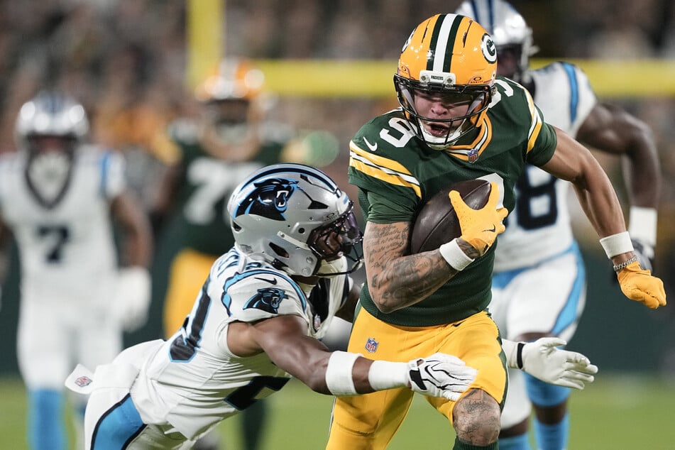 Green Bay Packers wide receiver Christian Watson makes a catch against the Carolina Panthers at Lambeau Field.