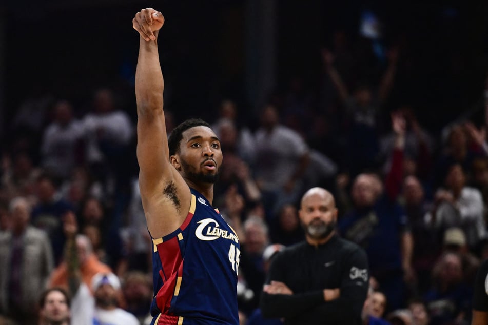 Cleveland Cavaliers guard Donovan Mitchell shoots a three-point basket against the Detroit Pistons during the second half of game four in the second round of the 2026 NBA Playoffs at Rocket Arena.