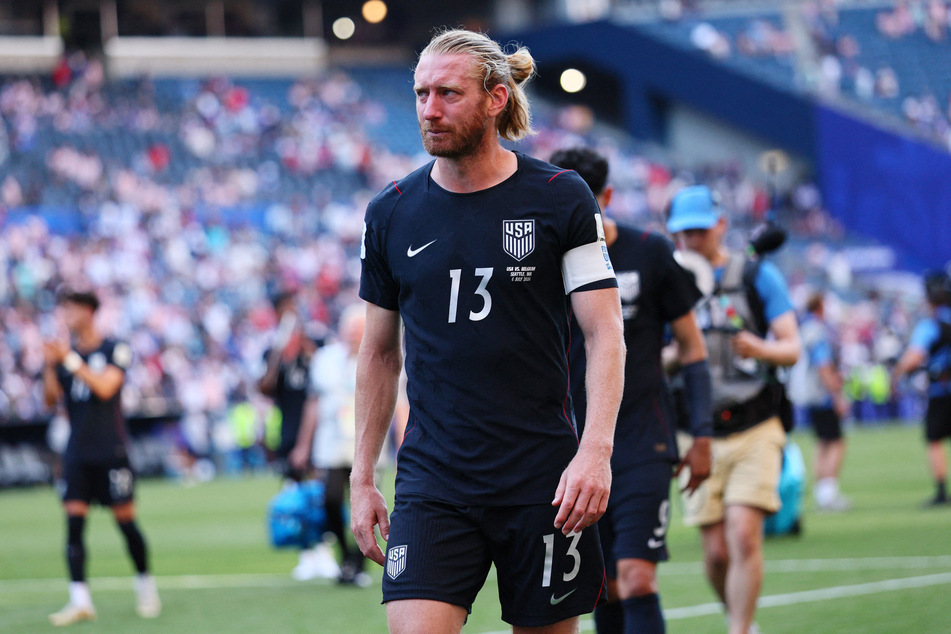 Team USA captain Tim Ream walks off the field after the match against Belgium following their elimination from the World Cup.