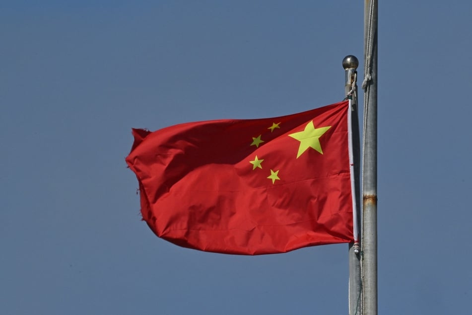 China has vowed to defend its national interests and hit back at any tariffs imposed on its exports.
