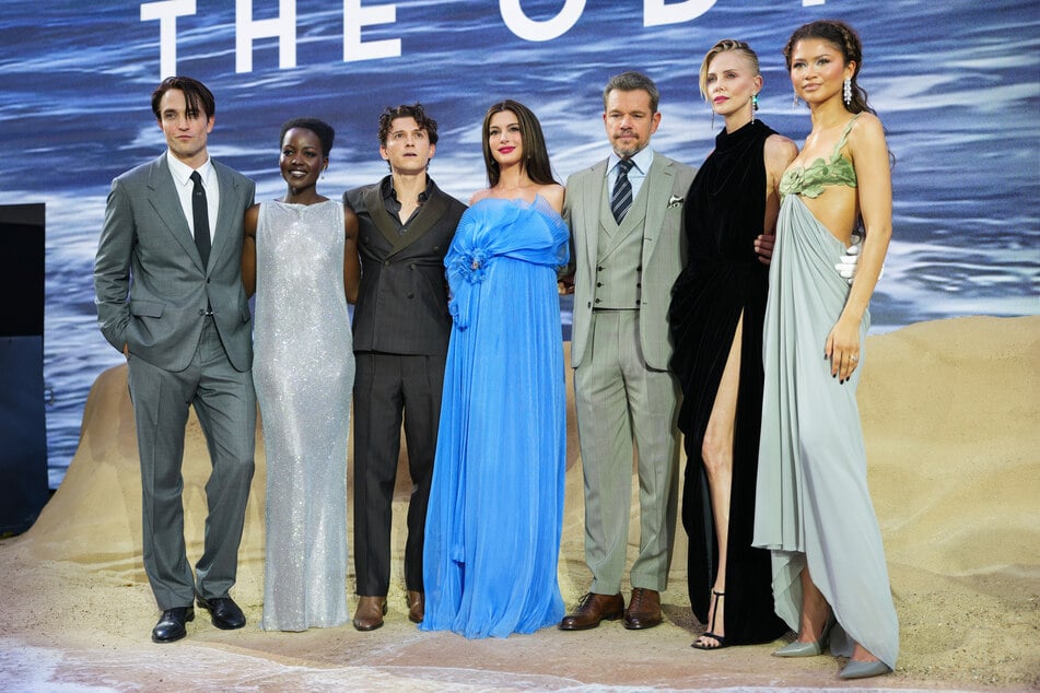 (From l to r) Actors Robert Pattinson, Lupita Nyong'o, Tom Holland, Anne Hathaway, Matt Damon, Charlize Theron, and Zendaya at the premiere of The Odyssey.