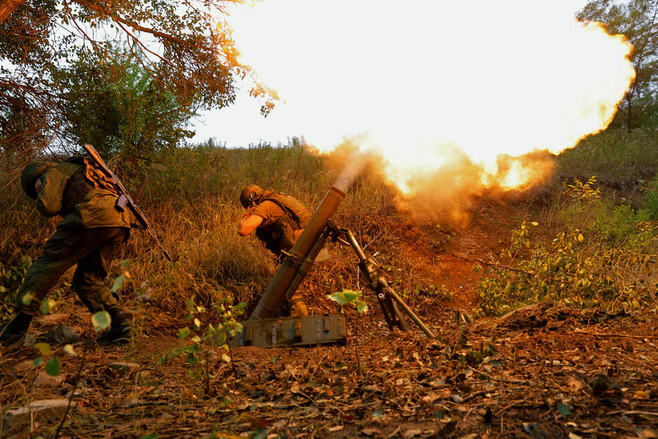 Pro-Russian troops firing a mortar outside of Donetsk.