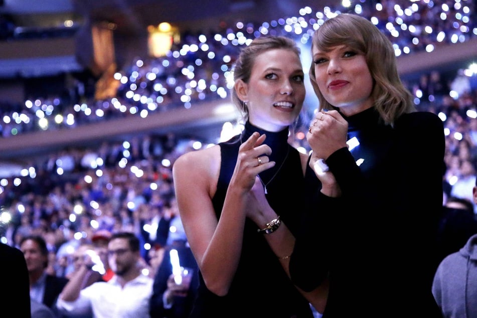 Karlie Kloss (l) praised Taylor Swift (r) and Travis Kelce as an "amazing couple" after attending their wedding on July 3 at Madison Square Garden.