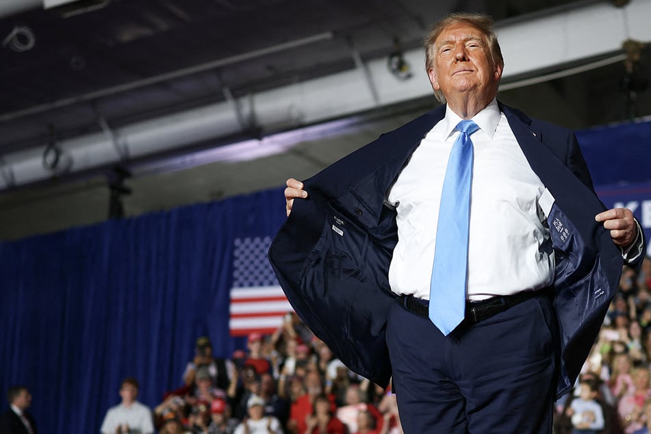 President Donald Trump wraps up an appearance at a campaign rally in Grand Island, Nebraska, on October 5. Political experts say the Republican wants to "go out with a bang" as he nears the halfway point of his second term.