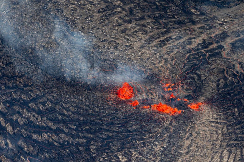 Kilauea's lava is confined to the summit, but volcanic particles and gases could still pose a threat to exposed people.