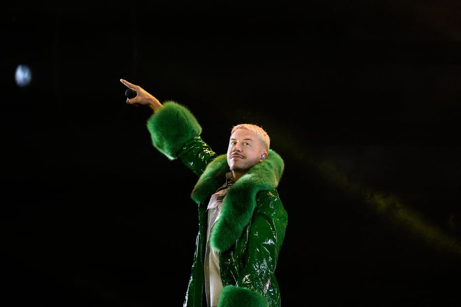 Macklemore performs at the Goldencoast Rap Festival in Corcelles-les-Monts, near Dijon, France, on August 30, 2026. His removal from Ed Sheeran's Loop Tour has sparked mass public outrage.