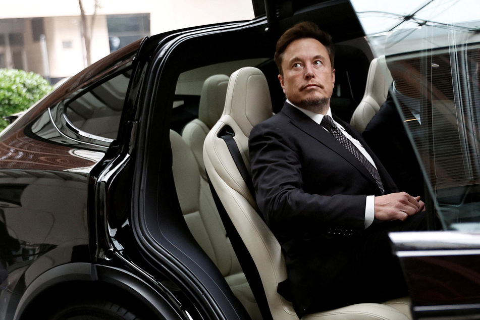 Elon Musk teases Tesla robotaxi and signals date for big reveal