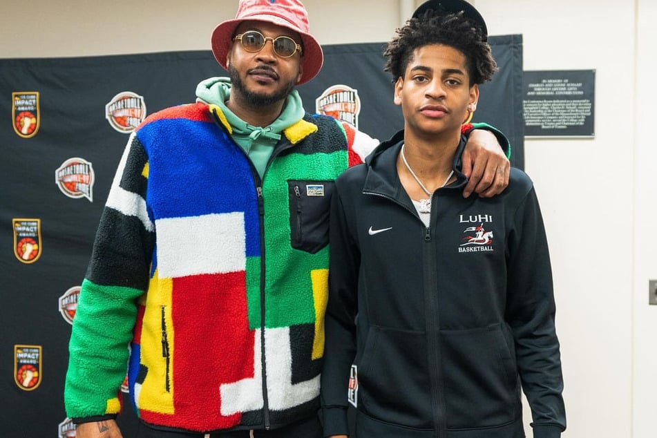 Carmelo Anthony has encouraged his son Kiyan (r.) to play multiple years of college basketball if it will enhance his skills for the NBA.