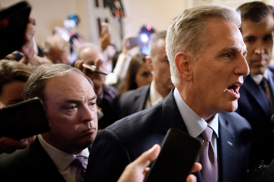 Speaker of the House Kevin McCarthy surrounded as he walked to the House Chamber ahead of a vote in Washington DC on Tuesday.