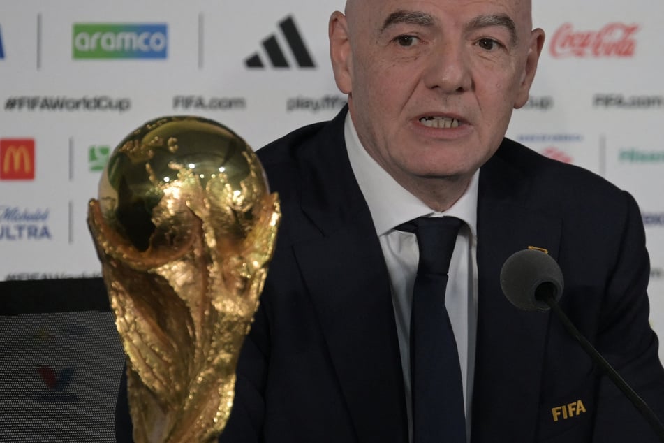 FIFA President Gianni Infantino gives a press conference with the World Cup trophy on the eve of the opening match of the 2026 World Cup football tournament at Mexico City Stadium in Mexico City on June 10, 2026.