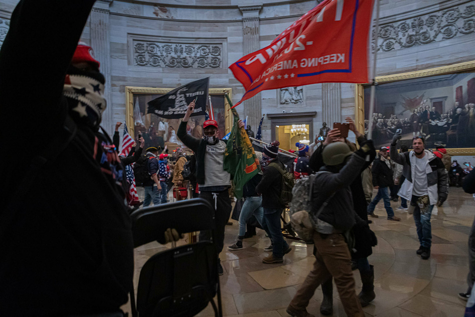 Man who carried Confederate flag in Capitol turns himself in