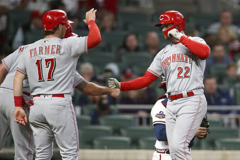 Cincinnati Reds third baseman Brandon Drury (r.) celebrates with shortstop Kyle Farmer after a three-run home run against the Atlanta Braves