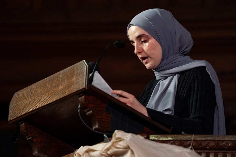 Dr. Noor Abdalla reads a statement from her husband, Mahmoud Khalil, at the People's Graduation in New York City on May 18, 2025.