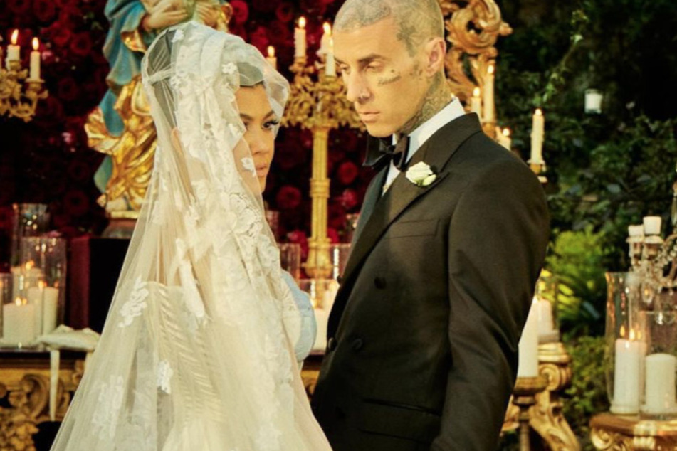 Kourtney Kardashian shared more intimate looks at her Italian nuptials with Travis Barker (r.) in honor of their two-year wedding anniversary.