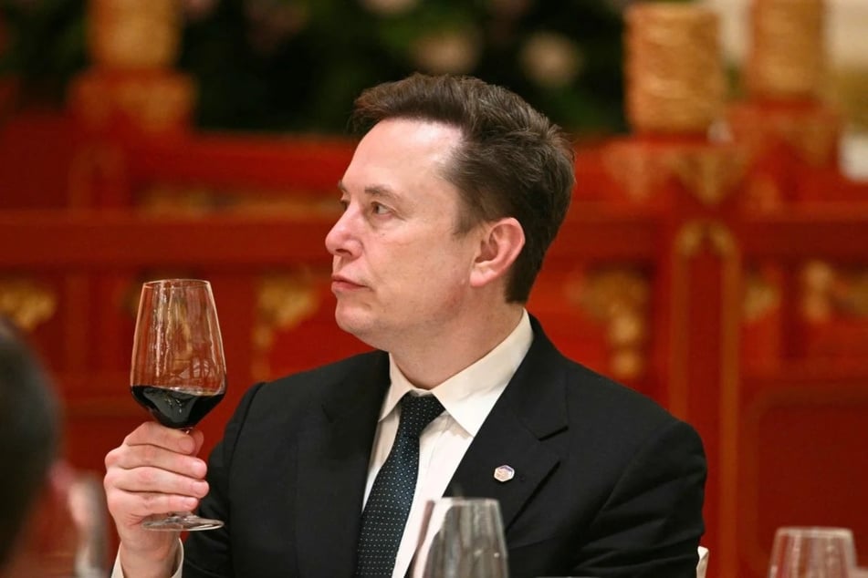 Elon Musk attends a banquet in Beijing on May 14, 2026. Multiple social media platforms recently refused to air an ad for an upcoming documentary about Elon Musk that the billionaire has called a "hit piece."