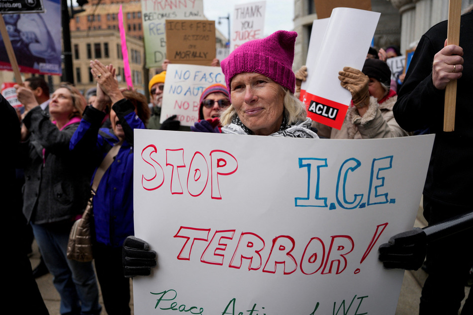 People protest in Milwaukee after Wisconsin judge Hannah Dugan was arrested by US officials, charging her with helping a man in her court evade immigration authorities.