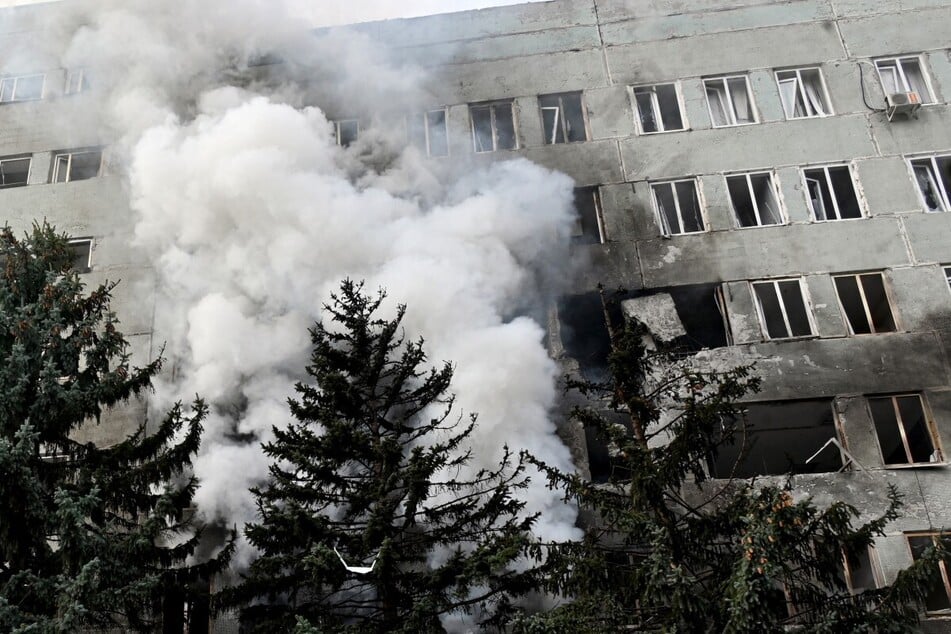 Smoke rises during a fire inside a clinic building after a Russian aerial attack on Kharkiv on October 10, 2026. Ukrainian authorities say at least 11 people were killed, including three children.