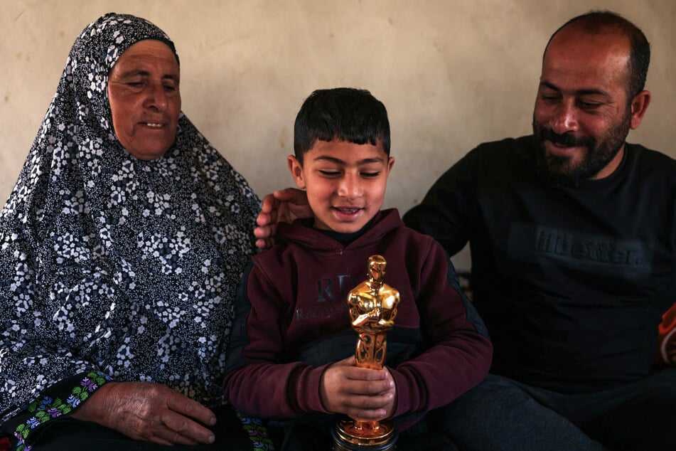 The Academy of Motion Picture Arts and Sciences has explained its silence on the Israeli settler attack on Oscar winner Hamdan Ballal (r.) – without naming him.