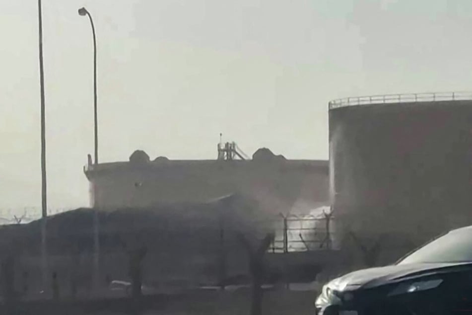 This screenshot from AFPTV video footage on September 19, 2026, shows a tank leaking at the scene of a fire near King Khalid International Airport in Riyadh. Yemen's Houthis issued a new threat to Saudi Arabia's airspace on Sunday after an attack on the airport.
