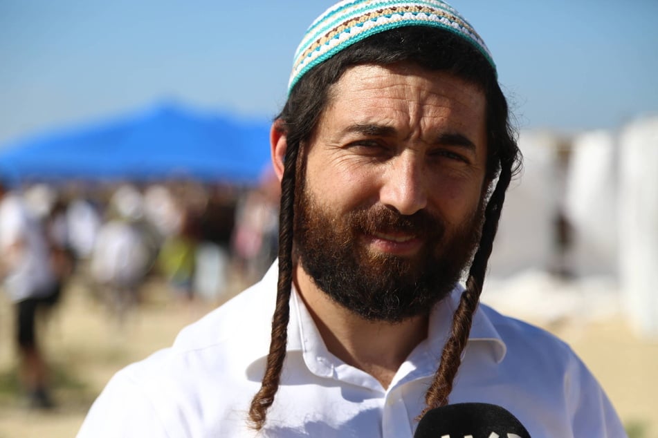 Likud MP Zvi Sukkot speaks to press during the Jewish religious holiday of Sukkot (Feast of Tabernacles) activities in Be'eri on October 21, 2024.