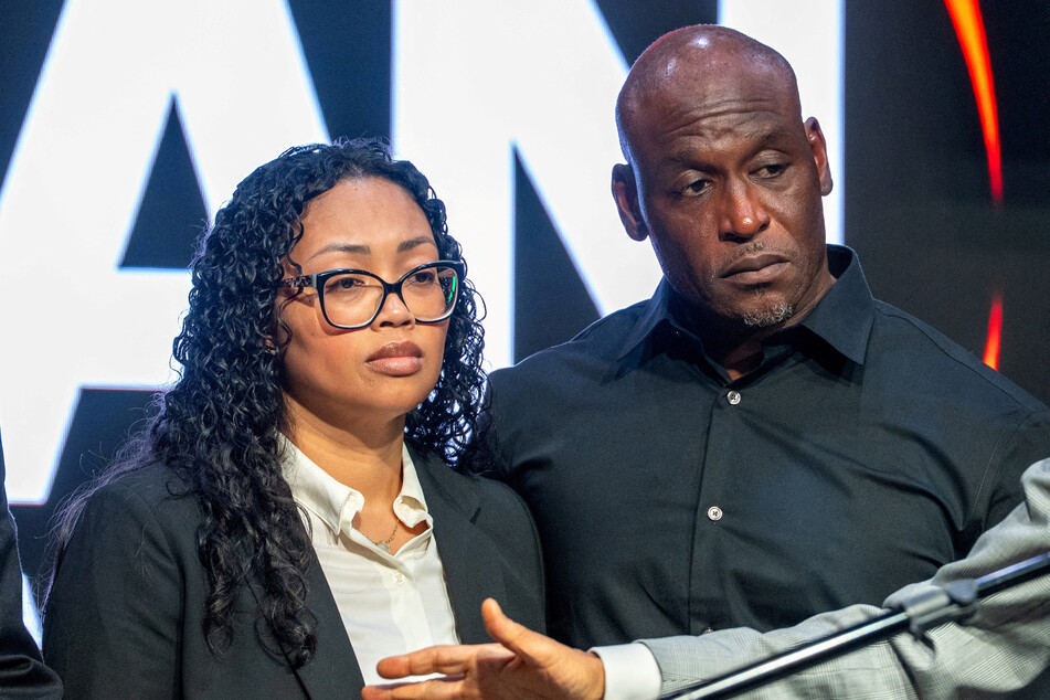 Nolan Wells' parents, Christine (l.) and Elmore Wonsley, appear on stage during a press conference in New York City on July 10, 2026.