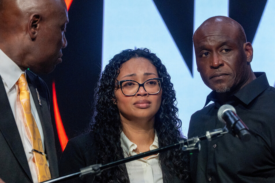 The family of Nolan Wells, along with attorney Ben Crum (l.), speaks to the media in New York City on July 10, 2026.