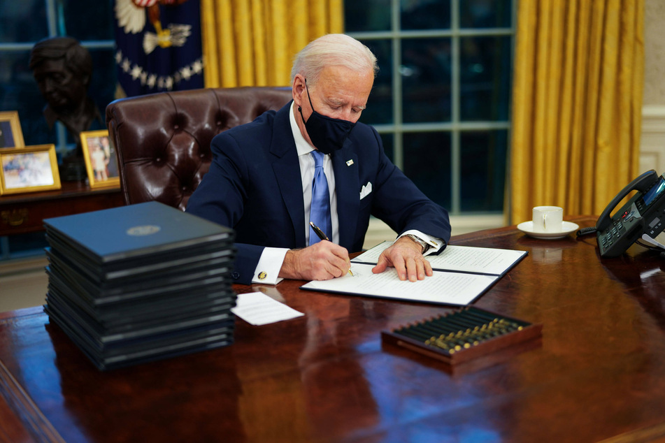 Biden issues raft of orders undoing key Trump policies on his first day
