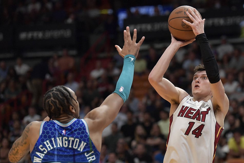 The Heat's Tyler Herro (r.) tied the single-game franchise record for points off the bench with 35.
