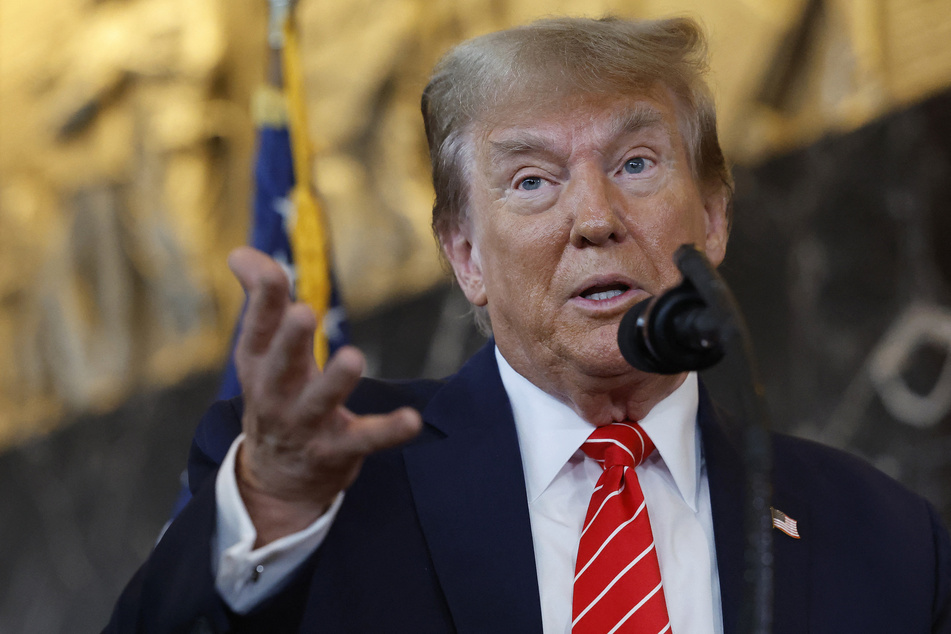 Republican presidential candidate and former US President Donald Trump talks to reporters at the International Brotherhood of Teamsters headquarters on Wednesday in DC.