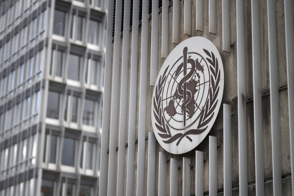 This photograph shows a sign of the World Health Organization (WHO) displayed at their headquarters in Geneva on March 13, 2025.