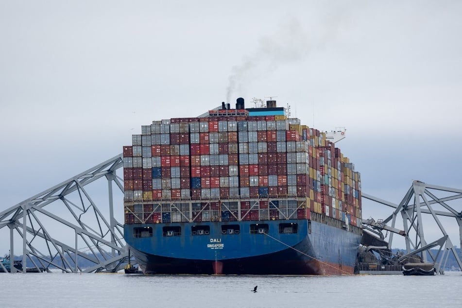 Wreckage from the collapsed Francis Scott Key Bridge rests on the cargo ship Dali in the Port of Baltimore.