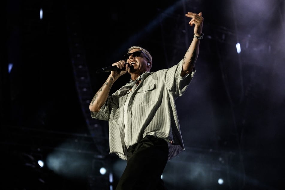 Macklemore performs on stage. The rapper kicked off his "Free Palestine Tour" in Ireland after being dropped as the opening act on Ed Sheeran's tour for saying "free Palestine" during a show. 